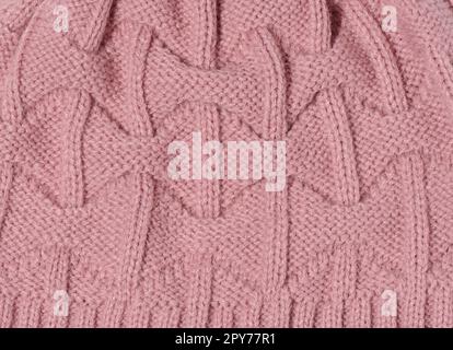 Texture of knitted pink fabric. Clothing detail, close up Stock Photo