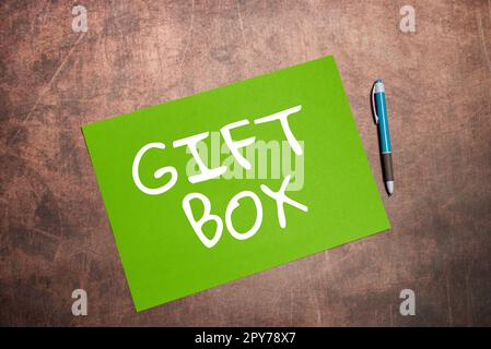 Hand writing sign Gift Box. Word Written on A small cointainer with designs capable of handling presents Stock Photo