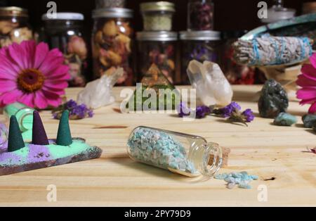 Incense Cones on Stone Slab With Crystals and Flowers Stock Photo