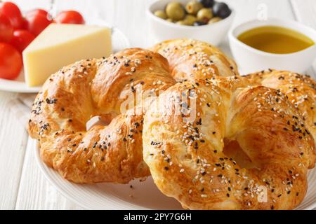 Traditional acma Turkish bread buns Freshly baked homemade pastry closeup on the plate on the table. Horizontal Stock Photo