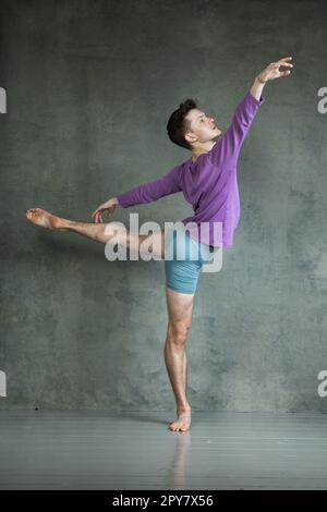 Man in casual office style clothes jumping and dancing isolated on grey  background. Art, motion, action, flexibility, inspiration concept. Flexible  caucasian ballet dancer, weightless jumps. Stock Photo | Adobe Stock