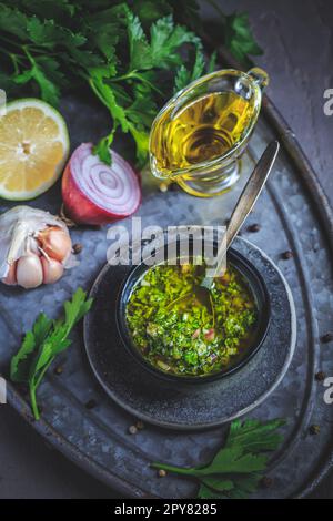 Chimichurri verde - Fresh traditional chimichurri sauce for barbecue meat Stock Photo
