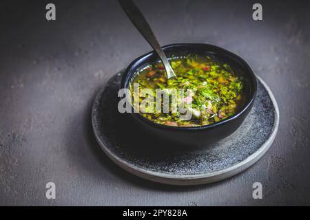 Chimichurri verde - Fresh traditional chimichurri sauce for barbecue meat Stock Photo