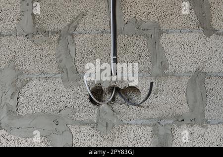 Electrical wiring power and internet cable during the construction of a private residential building Stock Photo