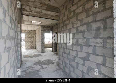 Construction of an individual residential building, a corridor from the front door to the rooms Stock Photo