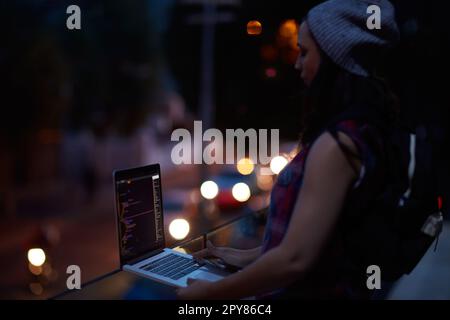 Destroying all the data. a young hacker using a laptop. Stock Photo