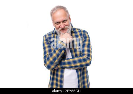 charming well-groomed senior pensioner gray-haired man with a beard in a shirt Stock Photo
