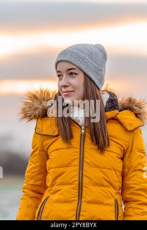 portrait of a beautiful teenage girl at sunset in nature Stock Photo