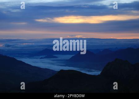 Sunrise view from Mount Brienzer Rothorn. Mount Stanserhorn and sea of ...