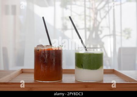 Ice Matcha Green Tea In Plastic Cup With Straw On Wooden Desk Stock Photo,  Picture and Royalty Free Image. Image 63010707.