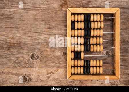 Vintage abacus on wooden background with copy space Stock Photo