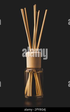 Bottle of aroma diffuser on a dark background Stock Photo