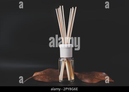 Bottle of aroma diffuser on a dark background Stock Photo