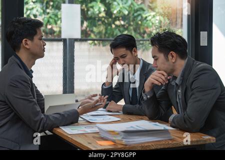 business team sitting stress and solving problem in office Stock Photo