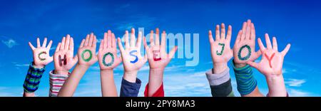 Children Hands Building Word Choose Joy, Blue Sky Stock Photo