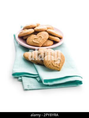 Sweet gingerbread hearts on napkin isolated on white background. Stock Photo