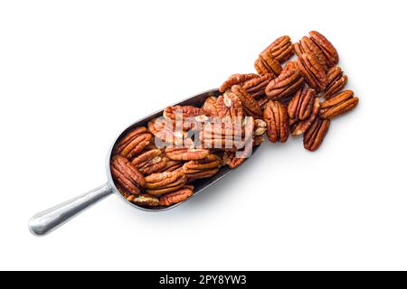 Peeled pecan nuts in scoop isolated on white background. Stock Photo