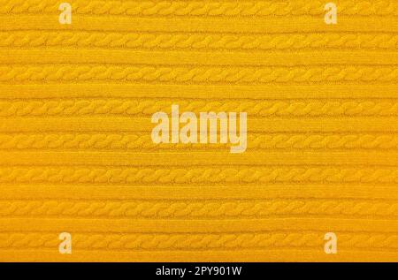 Background texture of yellow knitted wool fabric Stock Photo