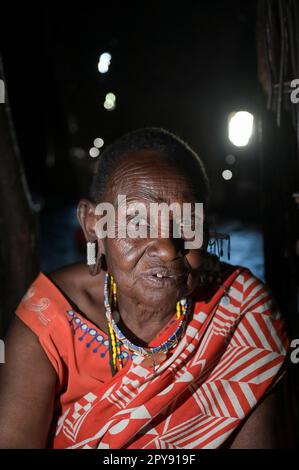 KENYA, Kajiado, Massai villages near town Mile 46, Massai pastoral tribe practise  FGM, female genital mutilation, old woman circumciser in her hut, impressive face Stock Photo