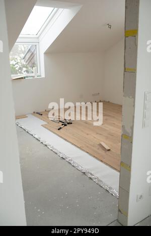 parquet floor laying in a new room, loft, new house Stock Photo