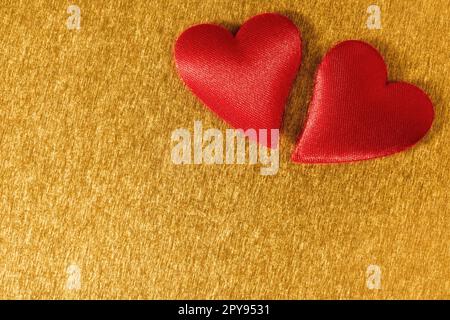 Valentine day background with two red hearts on shiny golden background Stock Photo