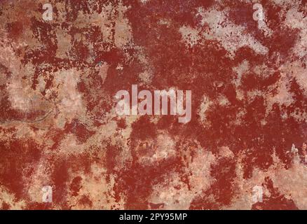 Grunge red brown old painted stone wall Stock Photo