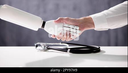 Doctor And Robot Shaking Hands Over Stock Photo