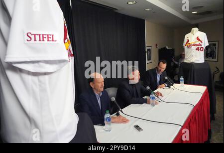 St. Louis Cardinals President Bill DeWitt III (R) points out the highlights  of the team's new uniform on pitcher Trevor Rosenthal at Busch Stadium in St.  Louis on November 16, 2012. For