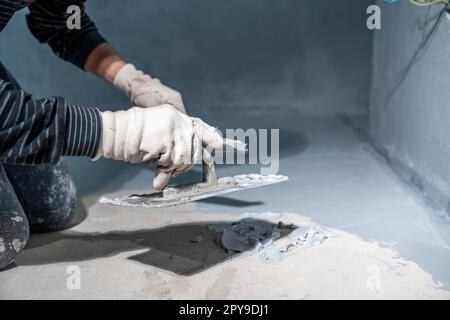 masonry work with a trowel on the construction site Stock Photo