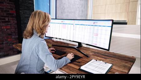 Data Analyst Woman Using Spreadsheet Stock Photo