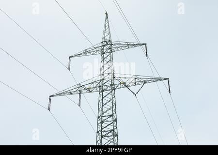 Electrical towers in winter landscape Stock Photo