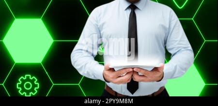 Businessman holding tablet with two hands. Glow going from device presenting important information. Futuristic digital design showing technological system. Stock Photo