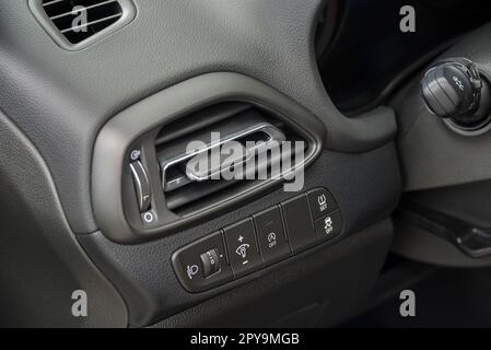 Air vent grill in a car. Air conditioner grid and control panel buttons. Stock Photo
