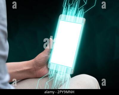 Person sitting and holding phone in one hand. Important information on the mobile phone display. Crllphone monitor glowing. Futuristic image with colored glow. Stock Photo