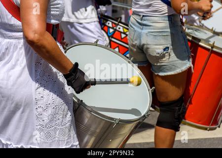 Drums and drummers playing samba during carnival celebrations in the streets of Brazil, Brasil Stock Photo