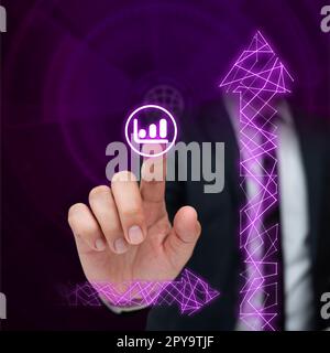 Man in black office suit sitting at the table and pressing virtual button with his finger. Futuristic digital design with colored glow. New technological infrormation. Stock Photo
