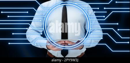 Businessman holding tablet with two hands. Glow going from device presenting important information. Futuristic digital design showing technological system. Stock Photo