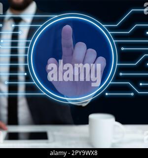 Man in black office suit sitting at the table and pressing virtual button with his finger. Futuristic digital design with colored glow. New technological infrormation. Stock Photo