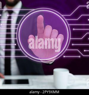 Man in black office suit sitting at the table and pressing virtual button with his finger. Futuristic digital design with colored glow. New technological infrormation. Stock Photo