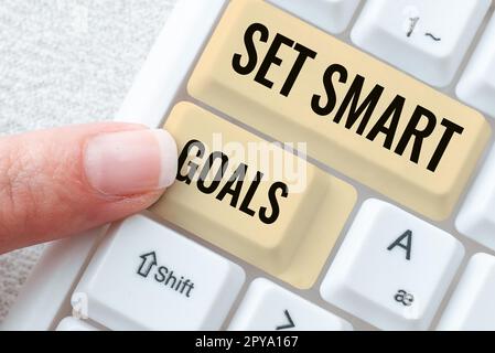 Hand writing sign Set Smart Goals. Business concept Establish ...