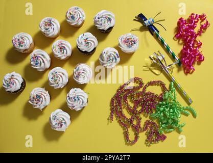 Cupcakes on Table at Party on Yellow Table Stock Photo