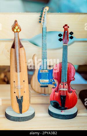 Set of models of musical instruments made of wood Stock Photo - Alamy