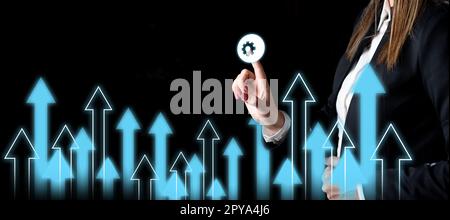 Lady in black office suit standing and pressing virtual button with her finger. Women presenting new technologies for future. Futuristic digital design with color glow. Stock Photo