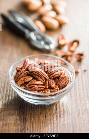 Peeled pecan nuts in bowl. Stock Photo