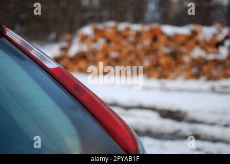 Closeup shot of the red tail light on a gray car Stock Photo