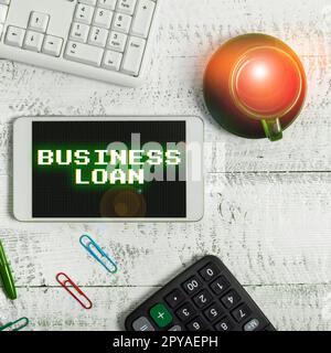 Hand writing sign Business Loan. Conceptual photo Credit Mortgage Financial Assistance Cash Advances Debt Stock Photo