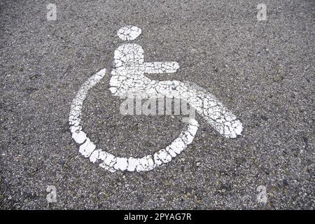 Disabled sign on the asphalt Stock Photo