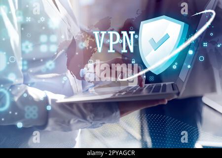 Woman using modern laptop with switched on VPN in office, closeup Stock Photo