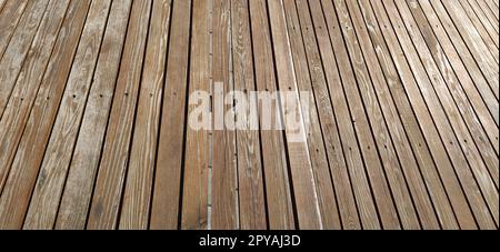 Beautiful smooth unpainted hammered boards. Wooden surface with cracks. A platform or staircase made of wood. Joiner's and carpentry product. The texture of natural material. Stock Photo