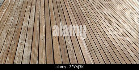 Beautiful smooth unpainted hammered boards. Wooden surface with cracks. A platform or staircase made of wood. Joiner's and carpentry product. The texture of natural material. Stock Photo